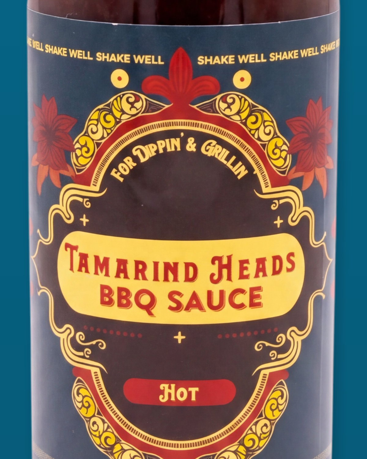 Detail of the Tamarind Heads Hot BBQ sauce label artwork