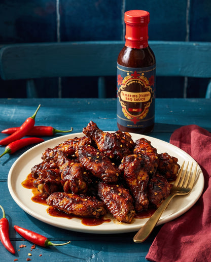 Tamarind Heads Hot BBQ sauce in use at the table