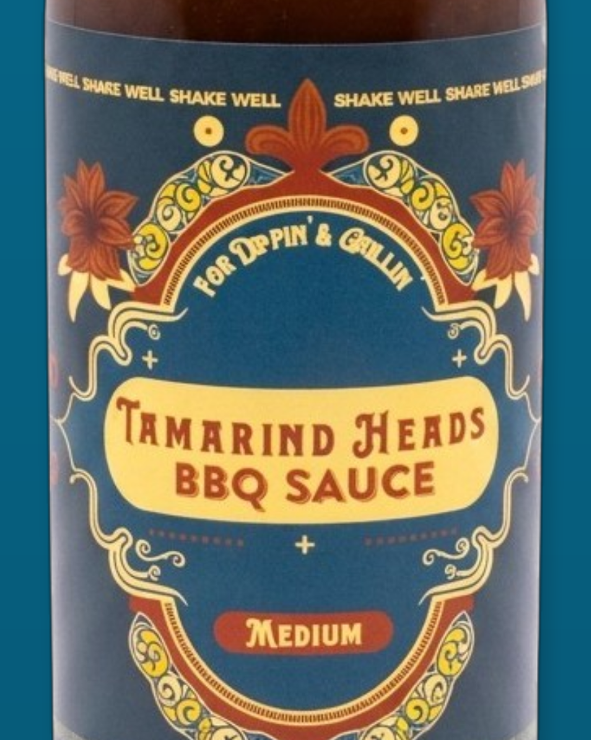 Detail of the Tamarind Heads Medium BBQ sauce label artwork